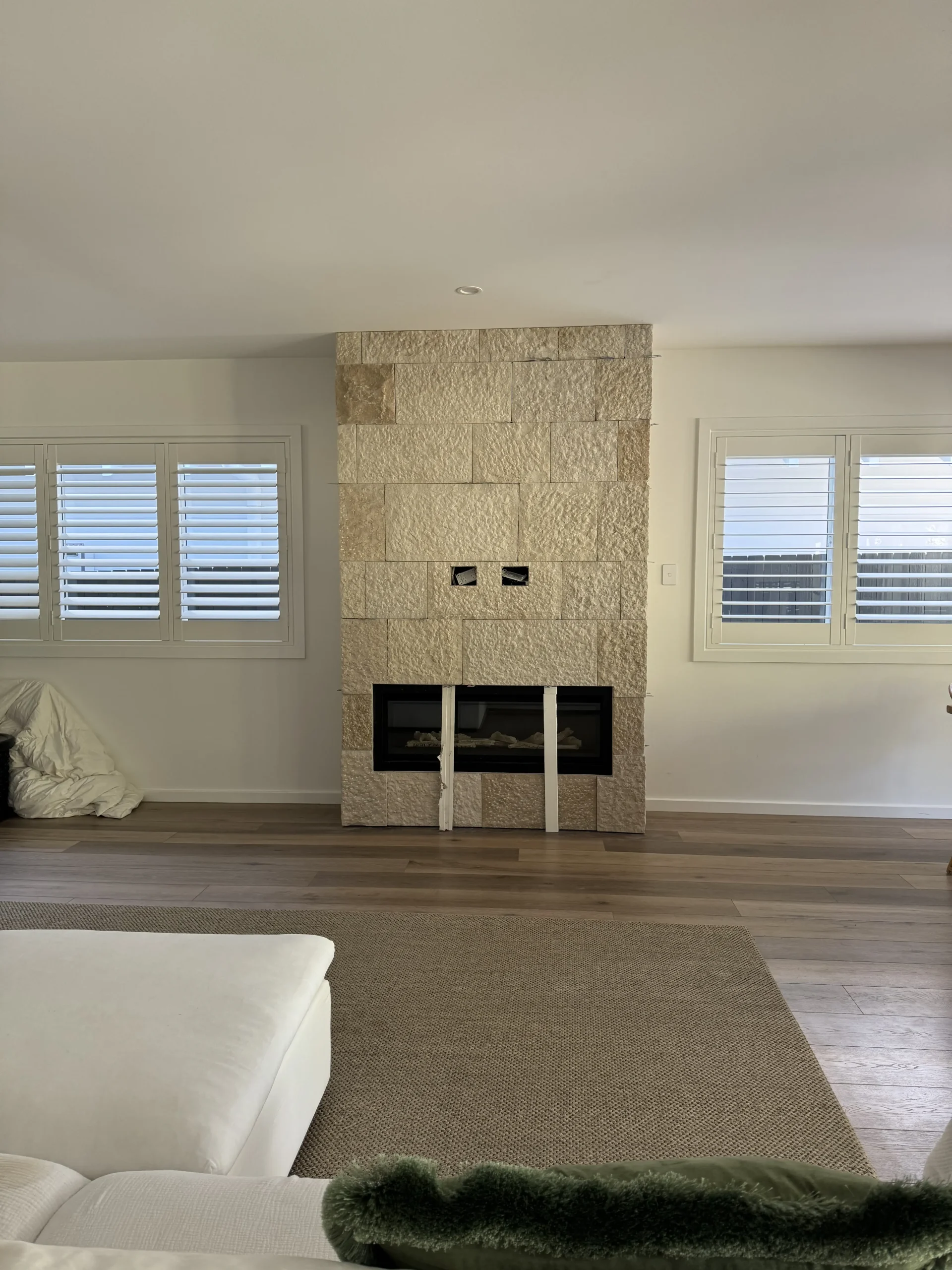 Stone-clad feature wall niche inside a home