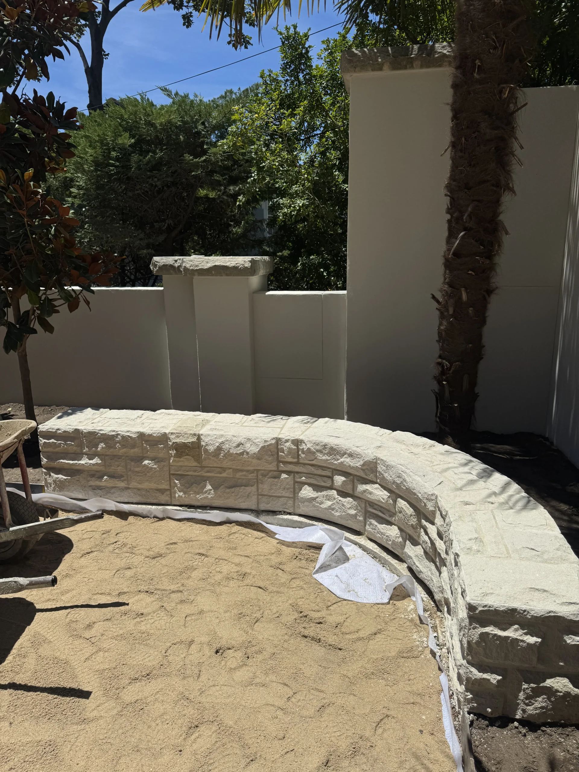 Sandstone archway nearing completion with cladding almost finished