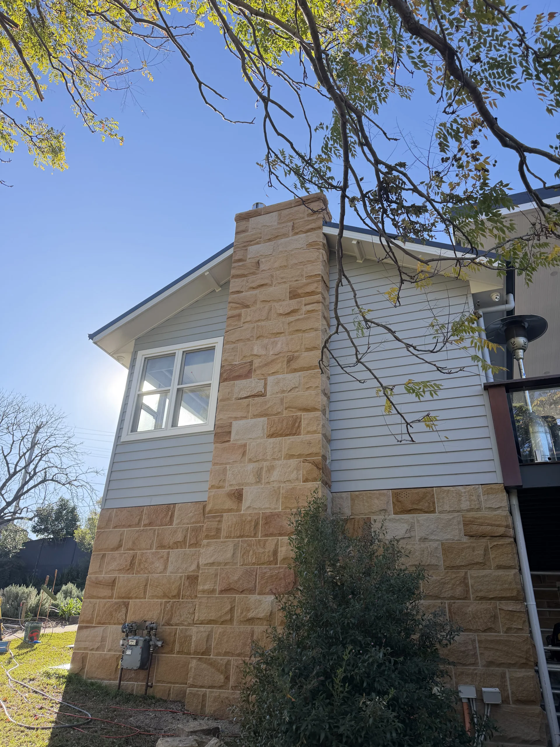 Sandstone cladding on a residential chimney
