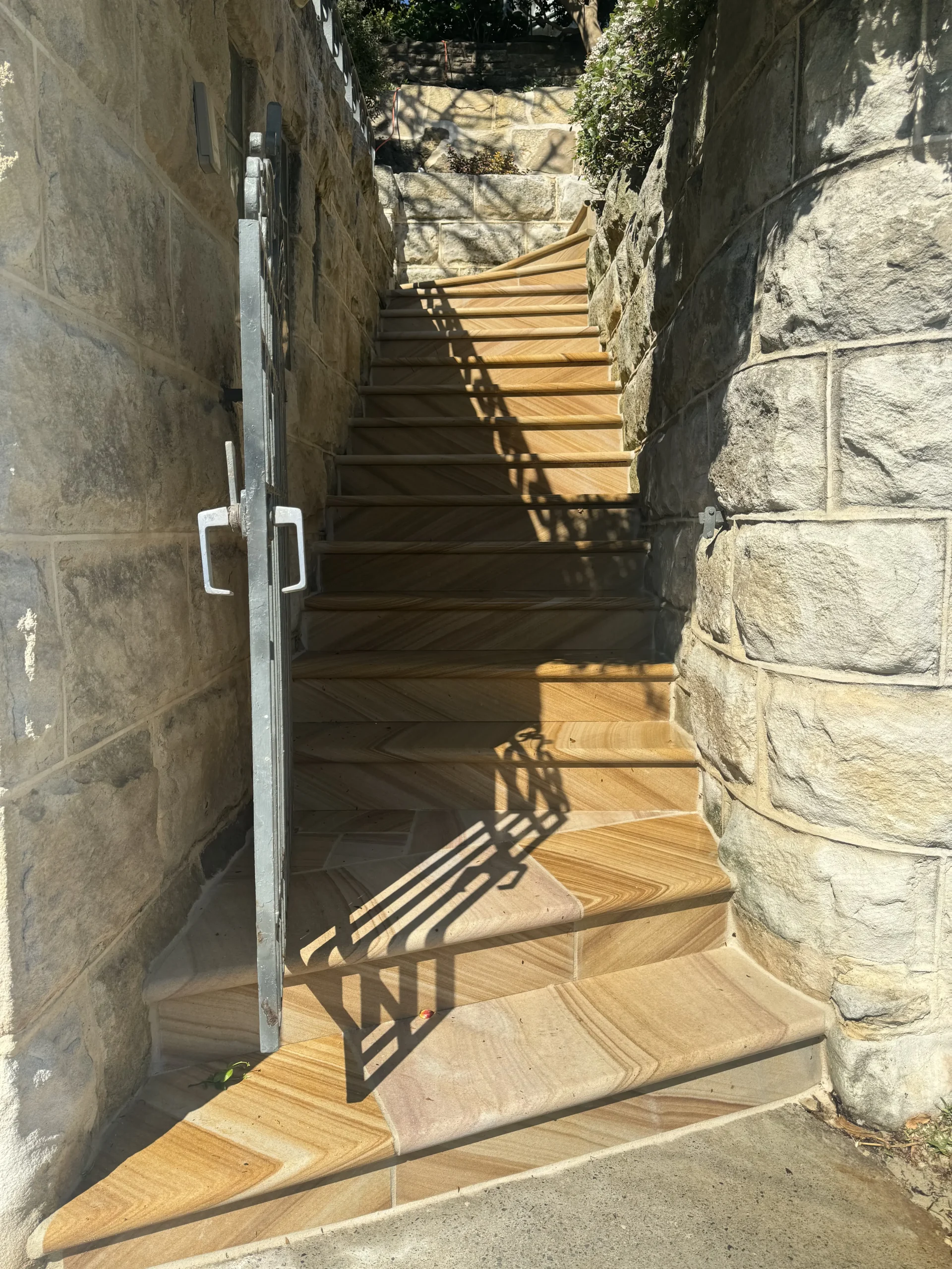 Sandstone staircase built into a garden landscape