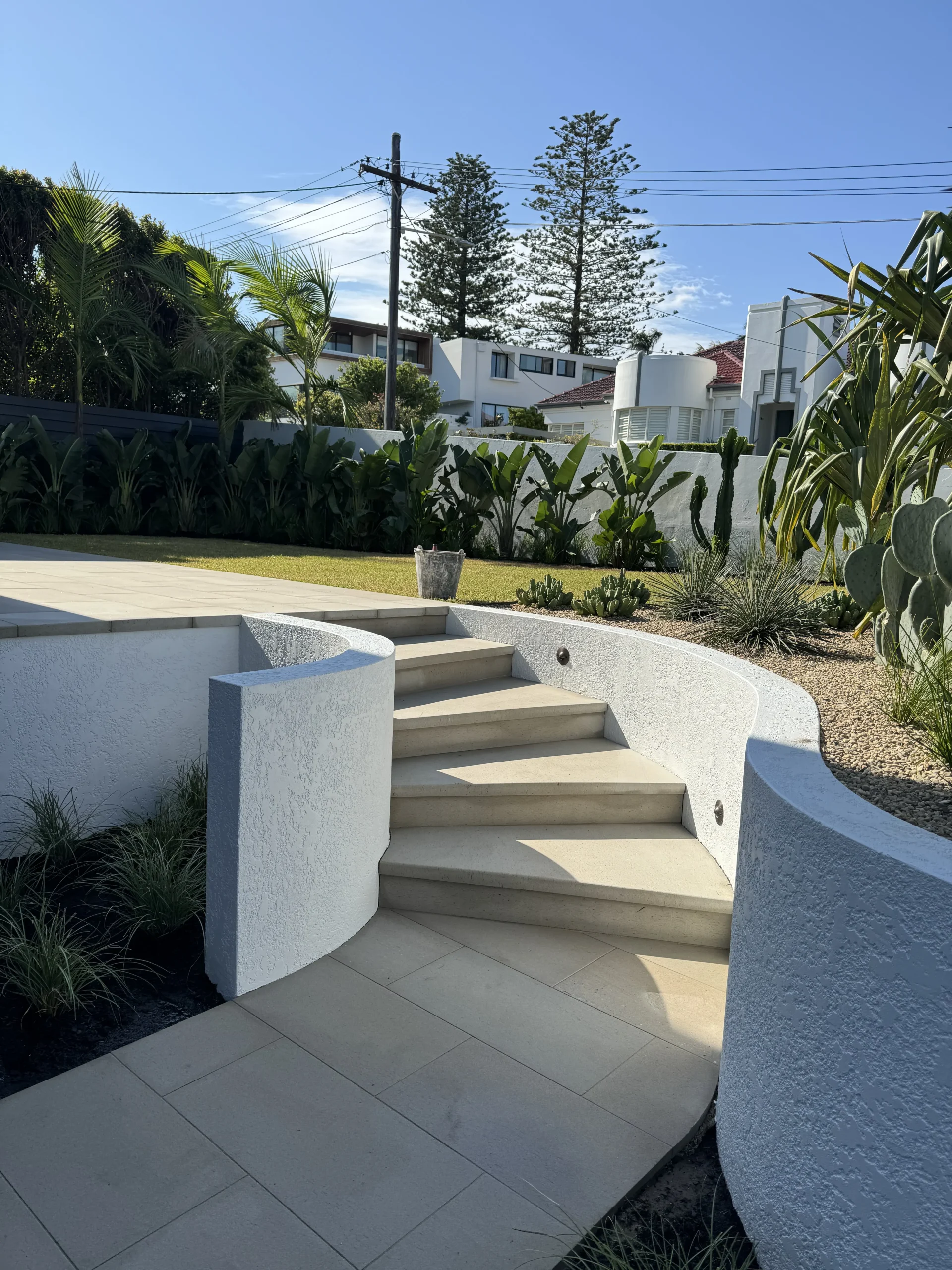 Sandstone garden steps surrounded by tropical planting